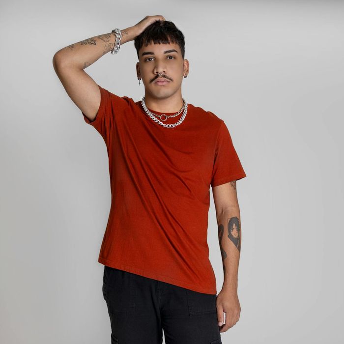 Serene person meditating in a minimalist silver studio.